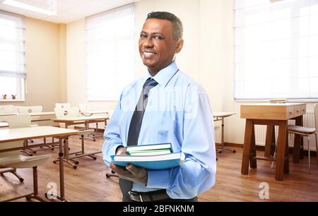 Portrait of teacher in modern class room at school Stock Photo