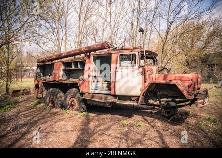 Old rusty abandoned Soviet fire truck in Chernobyl exclusion zone Ukraine Stock Photo