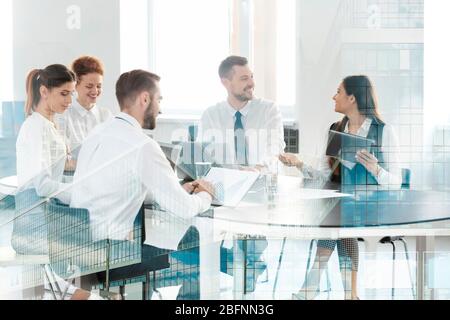 Double exposure of cityscape view and people working at table in office. Concept of financial trading Stock Photo