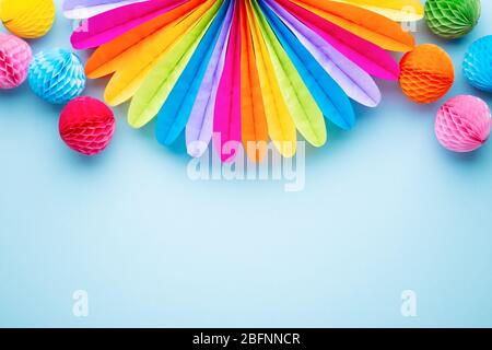 Colorful birthday party decoration on blue. Top view. Circus background. Stock Photo