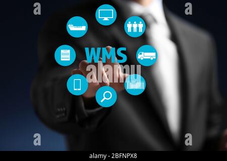 Warehouse management system concept. Man working with virtual screen Stock Photo