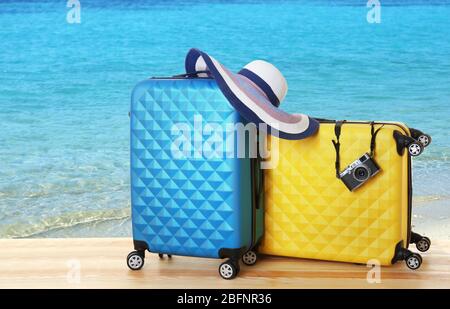 Travel concept. Suitcases on seascape background Stock Photo