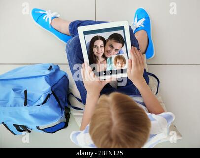 Video call and chat concept. Girl video conferencing on tablet Stock Photo