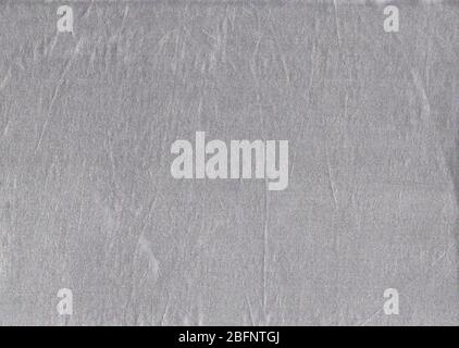 Silver fabric texture abstract background. Glossy metallic texture backdrop. Stock Photo