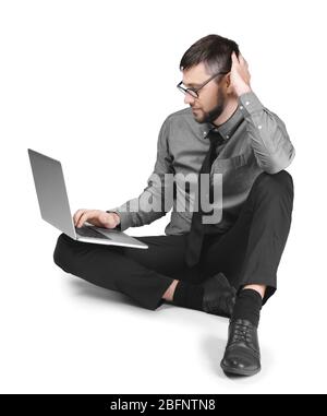 Handsome programmer with laptop on white background Stock Photo