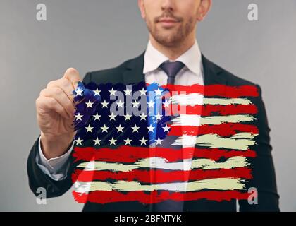 Man drawing USA flag on virtual screen Stock Photo