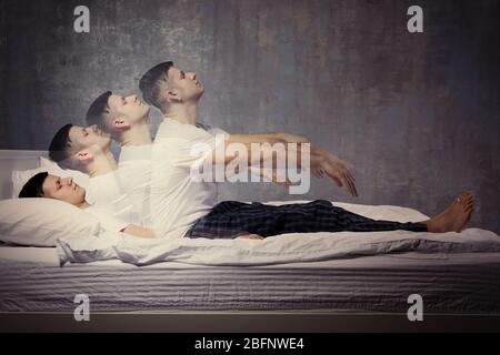 Young man suffering from sleepwalking Stock Photo