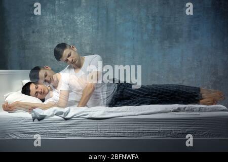Young man suffering from sleepwalking Stock Photo