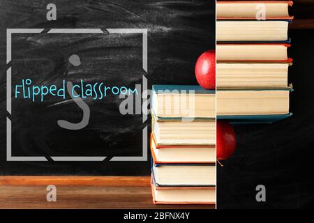 Flipped classroom concept. Books and apple on blackboard background Stock Photo