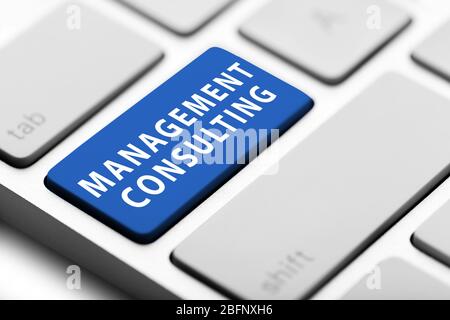 MANAGEMENT CONSULTING button on keyboard, closeup Stock Photo