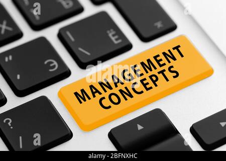 MANAGEMENT CONCEPTS button on keyboard, closeup Stock Photo