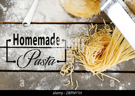 Raw homemade pasta on wooden background Stock Photo