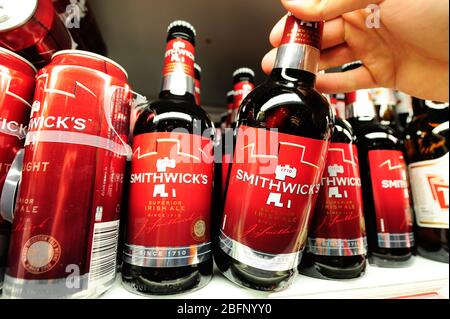 Smithwicks bottle been taken from the shelf (Newscast)(Model Released) Stock Photo