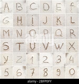 Set with letters and numbers written on scattered flour Stock Photo