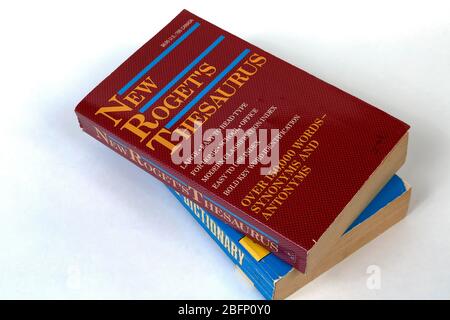 Paperback Thesaurus and  English Dictionary isolated on a pure white background. Stock Photo