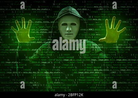 Hacker in mask working with virtual screen against dark background. Concept of cyber security and attack Stock Photo