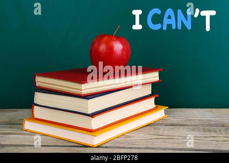 Word impossible transformed into possible on blackboard and textbooks Stock Photo