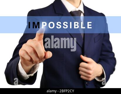 Human hand turning word impossible into possible Stock Photo