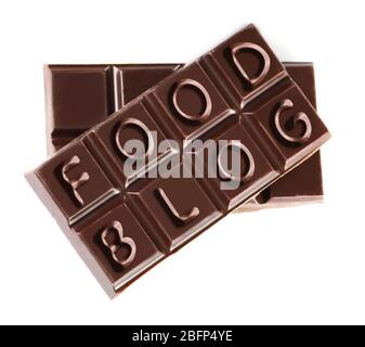 Black chocolate pieces isolated on white background. Food blog concept Stock Photo