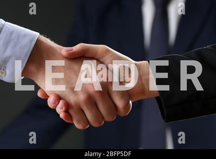 Business training concept. Handshake on dark background Stock Photo
