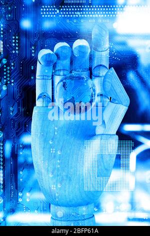 Robotic hand holding digital earth on circuit board background. Future technologies concept. Stock Photo