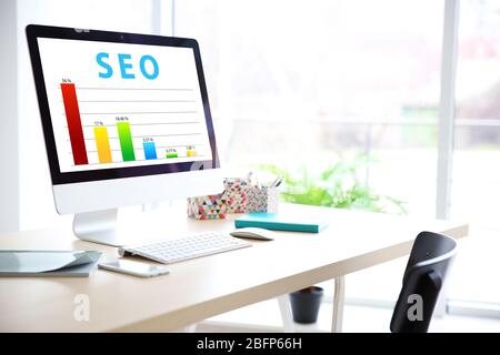 SEO technology concept. Modern workplace interior. Stock Photo