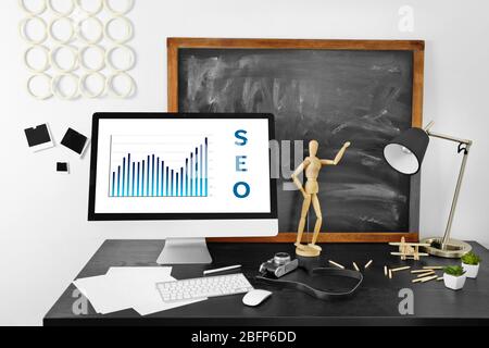 SEO technology concept. Modern workplace interior. Stock Photo