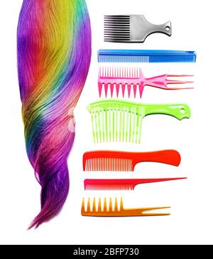 Shiny colorful hair and different combs on white background Stock Photo