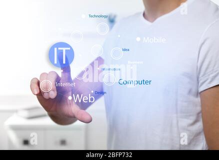 Male hand pushing button on virtual screen. IT technologies concept. Stock Photo