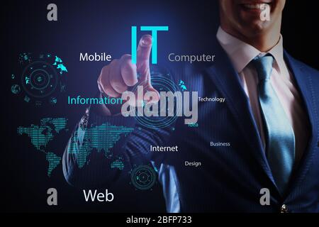 Businessman in suit working with virtual screen. IT technologies concept. Stock Photo