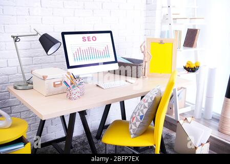 SEO technology concept. Modern workplace interior. Stock Photo