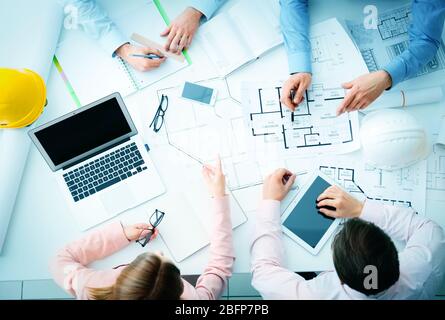 Young engineers working in the office, top view Stock Photo