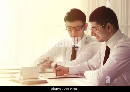 Two handsome lawyers working in office Stock Photo