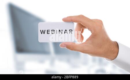 Business trainer with business card, close-up Stock Photo