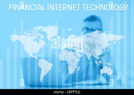 Financial internet technology concept. World map on blurred office workplace background. Stock Photo