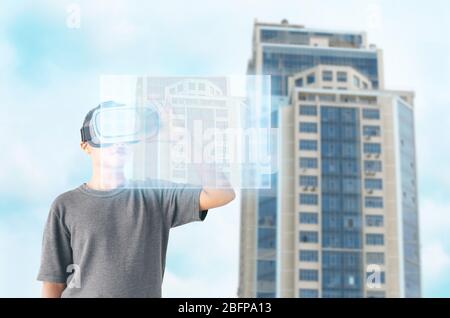 Technologies of the future concept.  Boy wearing virtual reality glasses Stock Photo