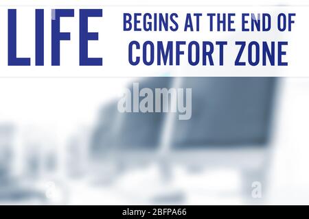 Comfort zone concept. Text on blurred view of modern computers in office Stock Photo