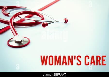Gynecology concept. Red stethoscope on white background Stock Photo
