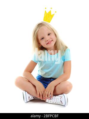 Cute little girl with princess crown drawing above head on white background. Stock Photo