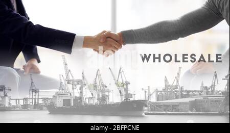 Logistics concept. Double exposure. Two men shaking hands and port in the sea Stock Photo
