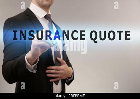 Insurance quote concept. Man working with virtual screen Stock Photo