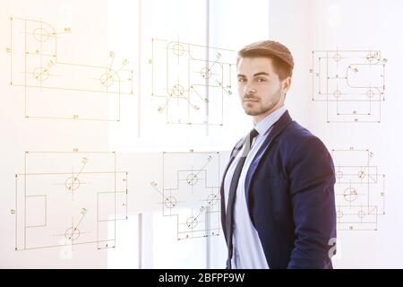 Marketing concept. Business man and drawing of details on background Stock Photo