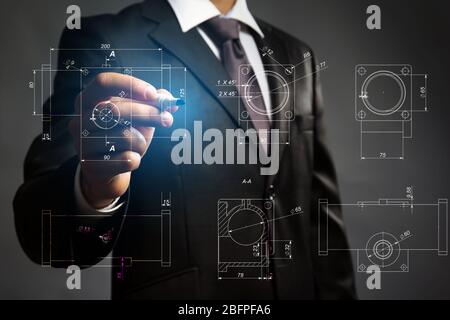 Marketing concept. Man drawing details on virtual screen Stock Photo