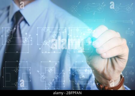 Marketing concept. Man drawing details on virtual screen Stock Photo