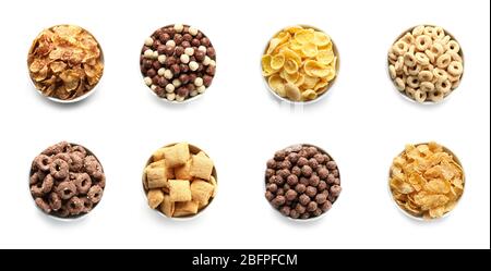 Bowls with different kinds of cereal breakfast on white background Stock Photo