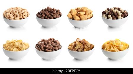 Bowls with different kinds of cereal breakfast on white background Stock Photo