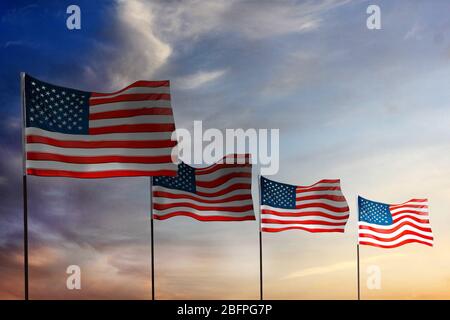 Waving USA flags on sky background. Patriotic concept Stock Photo