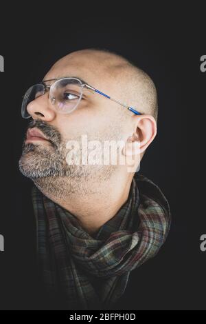 Stylish man smartly dressed in a scarf and suit. Stock Photo