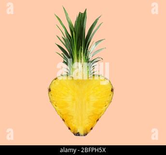 Heart shaped pineapple on color background. Superfood concept Stock Photo