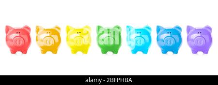 Colorful piggy banks on white background. Money savings concept Stock Photo